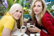 two female friends sharing coffee