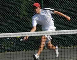 boy playing tennis